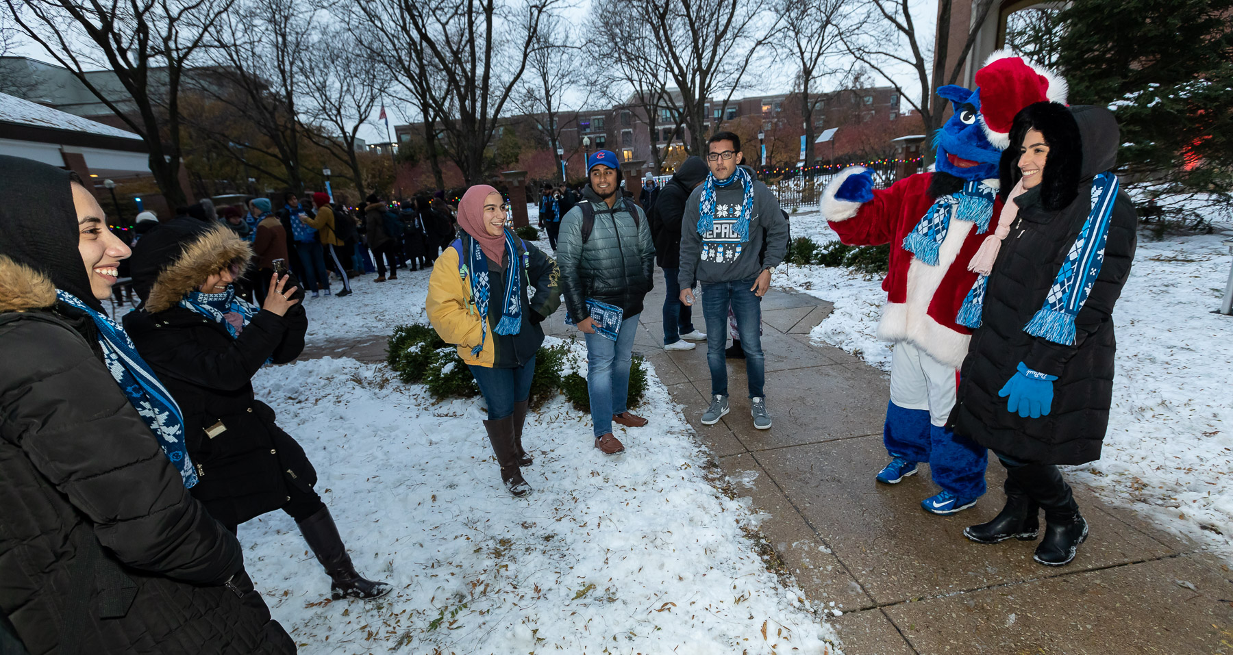 Students grab pictures with DIBS before the Tree Lighting Ceremony. (DePaul University/Jeff Carrion)